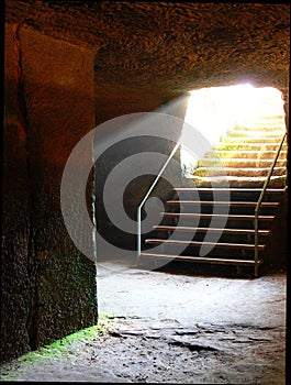 Cellar stairs of an old castle with sunbeams