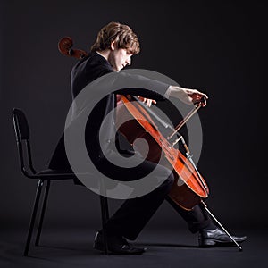 Cellist playing on cello