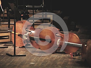 Cello music instruments on stage in concert hall