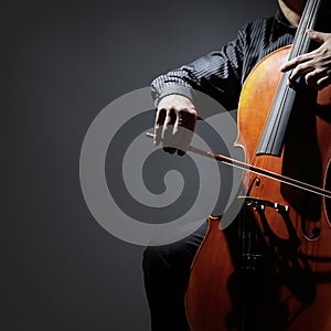 Cello player or cellist performing