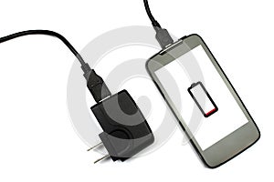 Cellphone and charger on white background, isolated