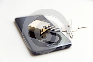 Cellphone data security - lock, keys and phone on white background