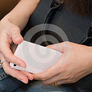 Cellphone in hands between waiting for an airplane