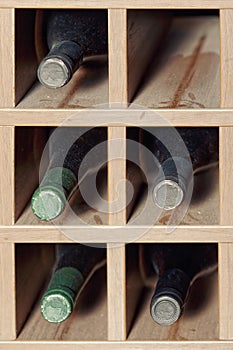 Cells with five wine bottles