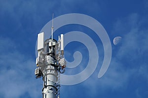 Cellular 5G network technology mobile telecommunications tower with mounted equipment - antennas, cables, electronic