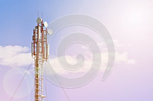 Cellular antenna against blue sky in sunset light with copy space. Concept of business communication