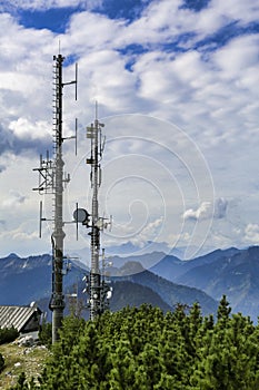 Cellular antenna masts on a mountain peak