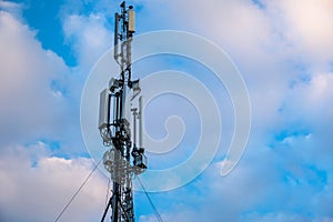 Cellular antenna. Mobile phone communication tower with blue sky