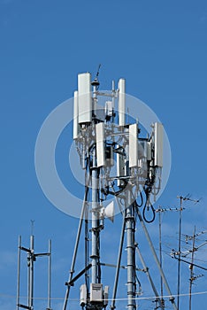 Cellular antenna steel towers in blue sky