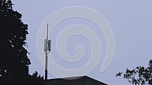 Cellular antenna or telecommunication antenna in thunder storm with bolts and thunderstorm lightning strikes dangerous weather