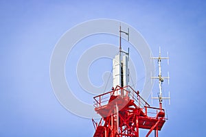 Cellular antenna and telecommunications against the blue sky.