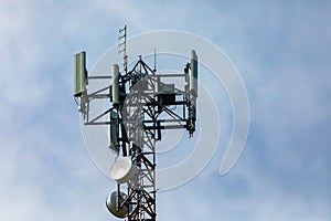 Cellular base station against cloudy sky