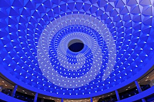 cellular ceiling lit up by blue led lighting