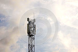 Cellular communication towers 5G on background of cloudy sky
