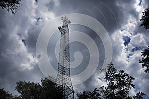Cellular mobile communications tower, against the background of the night sky