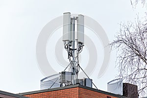 Cellular phone network telecommunication tower on the building roof