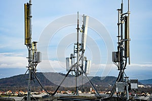 Cellular radio telecommunication network antenna mounted on a metal pole providing strong signal waves