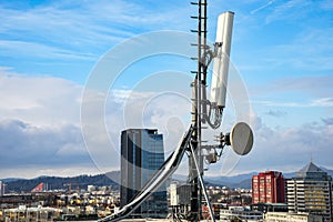 Cellular radio telecommunication network antenna mounted on a metal pole providing strong signal waves