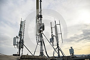 Cellular radio telecommunication network antenna mounted on a metal pole providing strong signal waves