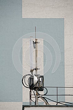 Cellular. A small base transceiver station is not against the wall of a neighboring house