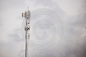 The cellular telecommunication antennas on the roof of the building