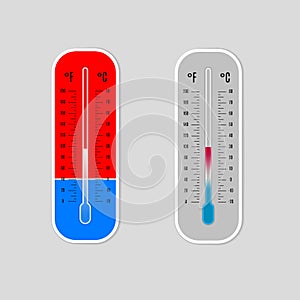 Celsius and Fahrenheit meteorology thermometers isolated on grey background. Hot and cold themperature. Sun and