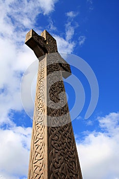 Celtic cross against blue sky.