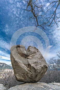 Celtic Vetton sacred place Nemeton, Large boulder of granite rock surounded by trees at Silla de Felipe II Phillip II chair photo