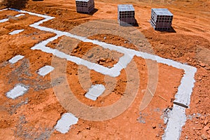 Cement blocks delivered to a construction site with foundation is ready for mounting wall