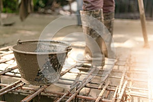 Cement bucket on steel bar wire mesh for construction