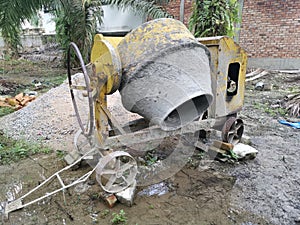 Cement or concrete mixer machine located on the construction farm