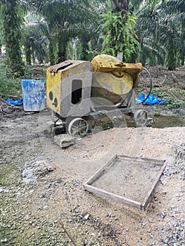 Cement or concrete mixer machine located on the construction farm