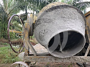 Cement or concrete mixer machine located on the construction farm