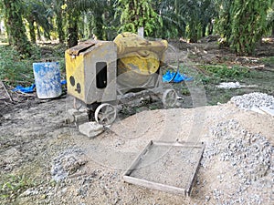 Cement or concrete mixer machine located on the construction farm