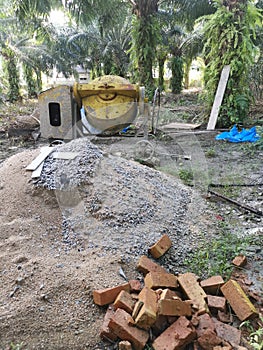 Cement or concrete mixer machine located on the construction farm