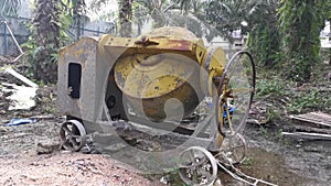 Cement or concrete mixer machine located on the construction farm