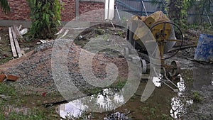 Cement or concrete mixer machine located on the construction farm