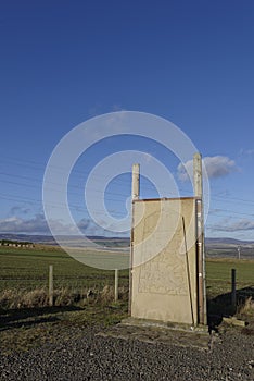 A cement copy of one of the Aberlemno Sculptured Stones mounted on a metal and wood Frame