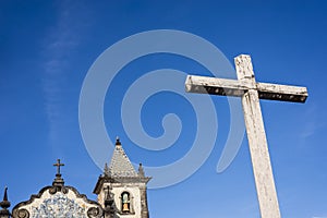 Cement cross of Boa Viagem church against blue sky