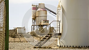 Cement factory abandoned in the middle of an arid wasteland