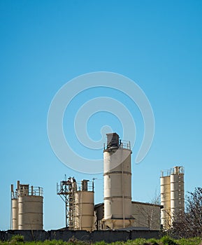 cement factory, cloudless sky