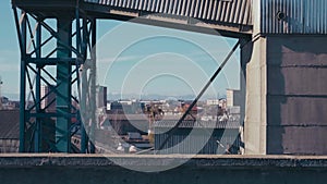 Cement factory at industrial production area. Cement silos and industrial trucks