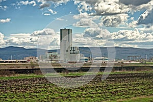 Cement factory on the outskirts of a city 