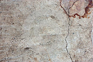 Cement floors are old and dirty.