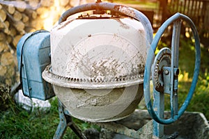 Cement mixer in construction area. Old cement mixer