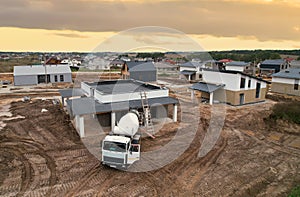 Cement mixer truck pouring mix during building a country house. Formworks and pouring concrete at private home of ceramsite