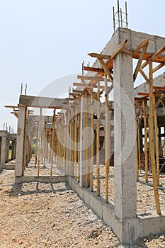 Cement pillar and wood in construct site