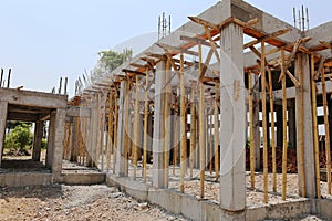 Cement pillar and wood in construct site