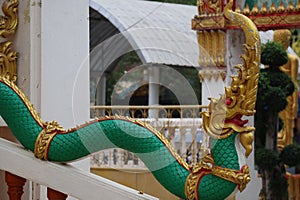 A cement pillar depicting a serpent, a literary animal housed in a Thai temple, is beautiful, Thai culture.