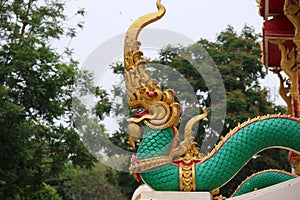 A cement pillar depicting a serpent, a literary animal housed in a Thai temple, is beautiful, Thai culture.